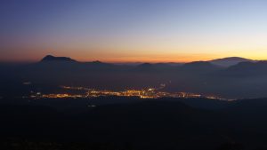 Durango city at night with Urkiola mountains