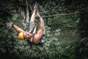 Man zipline flight in jungle